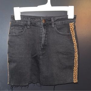 Black mini skirt with cheetah print sliver on both sides